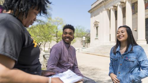 Students having conversation outside of Camden campus building