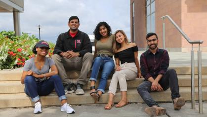 Group of students sitting on steps