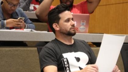 A Rutgers Newark student listens during a lecture