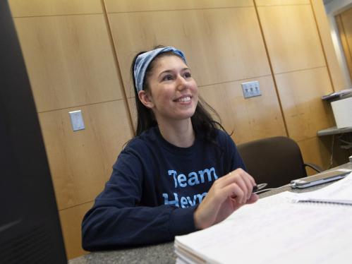 A student sits at a desk