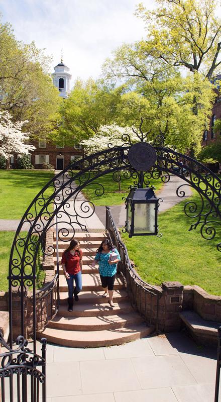 Two college students walk on Rutgers–New Brunswick's Old Queens